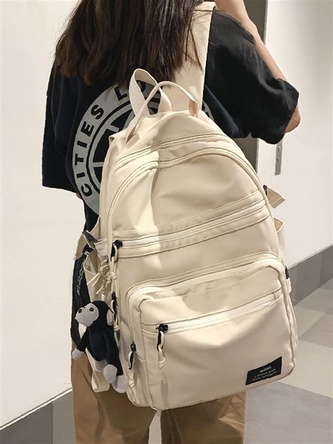 beige backpack for school.